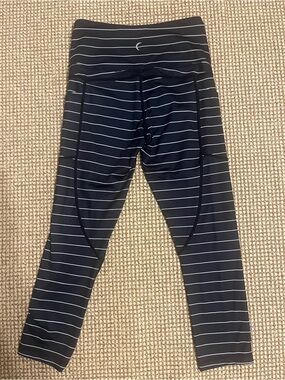 Zyia**Cropped Black Striped Leggings with Reflective Logo